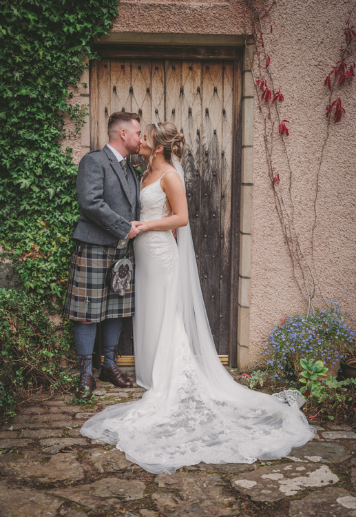 Bride and groom in the doorway taken by Aberdeenshire wedding photographer