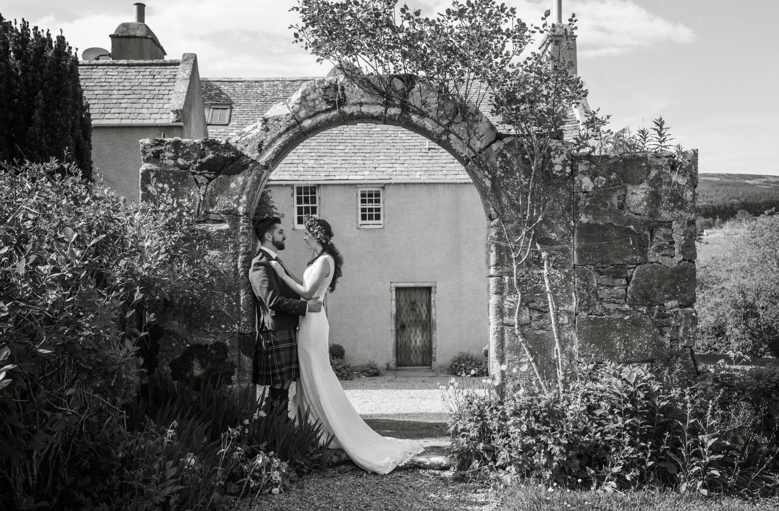 Garden and archway of Aswanley wedding venue on Lottie and Chris' wedding day