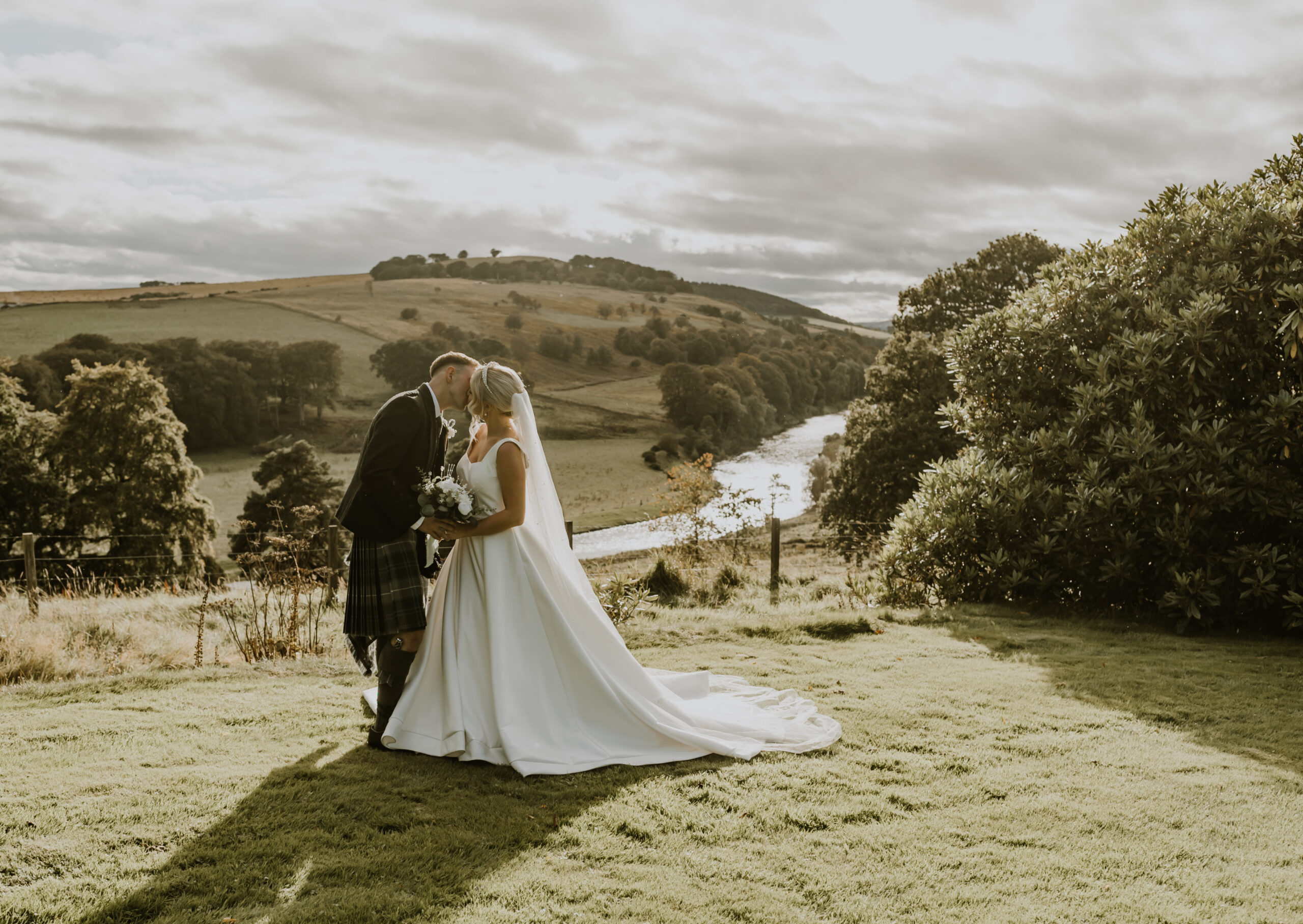 View of the Deveron valley behind a newly married couple at Netherdale House exclusive use venue